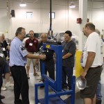 Penn College instructor Roy H. Klinger schools participants on forming sheet-metal panels.