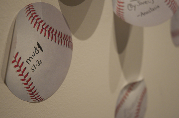 A wall is reserved for visitors to finish the sentence, “I love Little League because …”