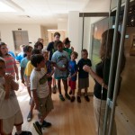 Penny G. Lutz, Madigan Library gallery assistant, welcomes young visitors to the exhibit.