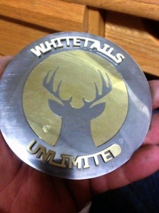 Penn College student Nicholas J. Judge, of Telford, a sophomore majoring in manufacturing engineering technology, made two belt buckles using electrical discharge machining. One of the pair was auctioned to raise money for Whitetails Unlimited; the other was presented to Outdoor Channel personality Travis “T-Bone” Turner