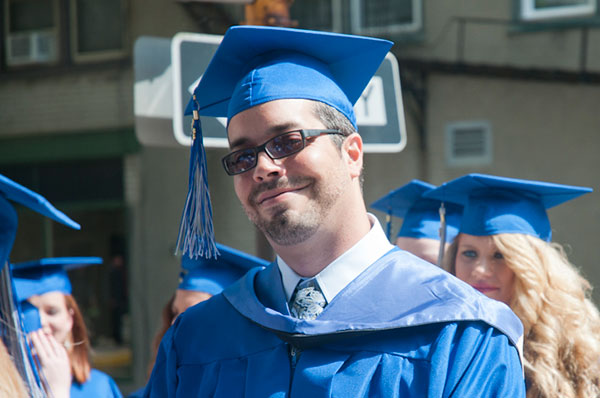 Joseph C. Sarmento, graduating in applied health studies: radiography concentration, proceeds to the Community Arts Center.
