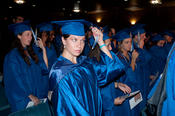 ... as the student speaker's classmates follow suit.