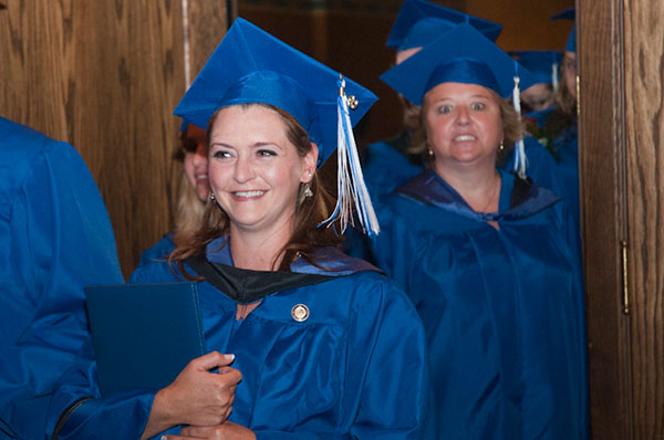 Her cap says “Nurses Rock” – and her face does, too.