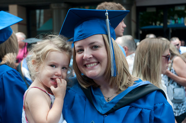 Smiling in the arms of a new grad