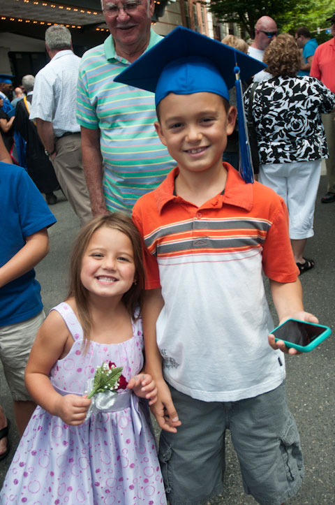 Fully participating in the celebration – with their favorite graduate’s cap and corsage.