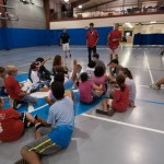 Crosscutter players answer questions from their summer-camp audience during a campus visit.