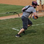 A student competitor puts his all into one of the between-innings contests at Bowman Field.