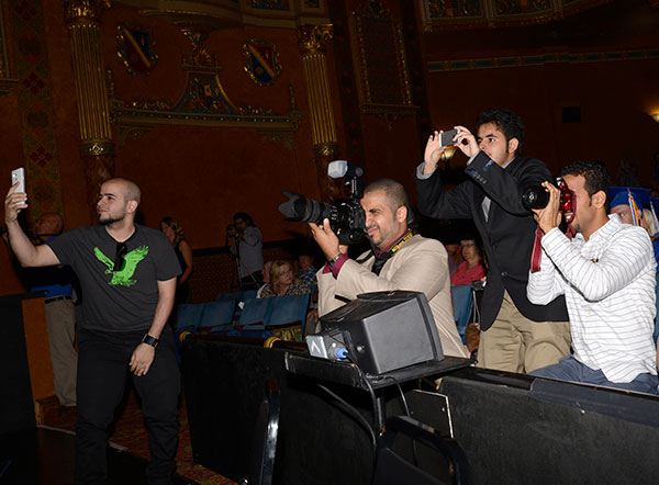 With as many devices as there are camera angles, photographers document the day.