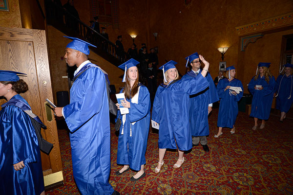 The morning's V.I.P.s move through the arts center foyer.