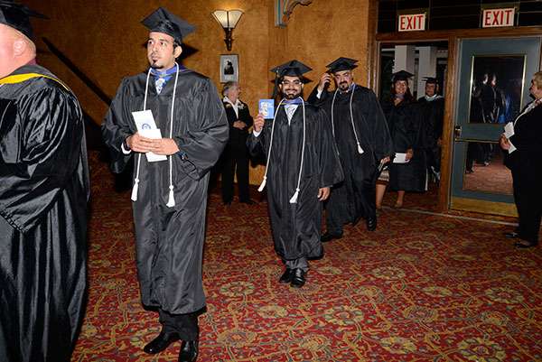 Graduates from plastics and polymer engineering technology march into their future.