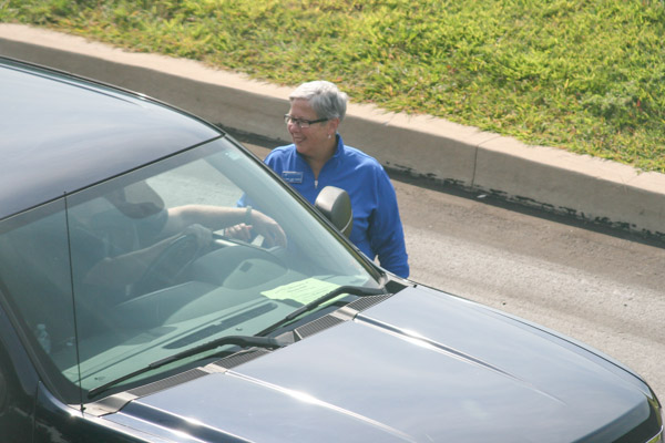 College President Davie Jane Gilmour directs traffic ...