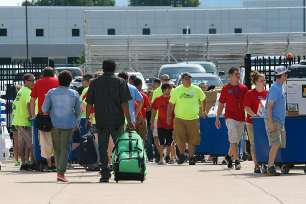 Between Delaware and Clinton halls, a large crowd is captured coming and going.