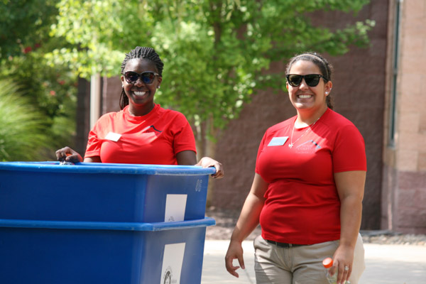 Resident Assistants Chesnya I. Cherelus (left) and Brittany L. Delmo are all smiles as the new school year begins.  