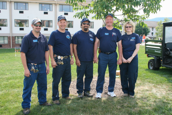 A smiling team of General Services workers, ready to serve