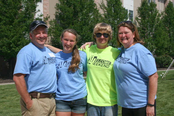 The Moore, the merrier! Shelley L. Moore, assistant director of career services (right), brought along her family to volunteer, too! From left are husband Todd R. ('86 advertising art), daughter Gabbie and son Evan. 