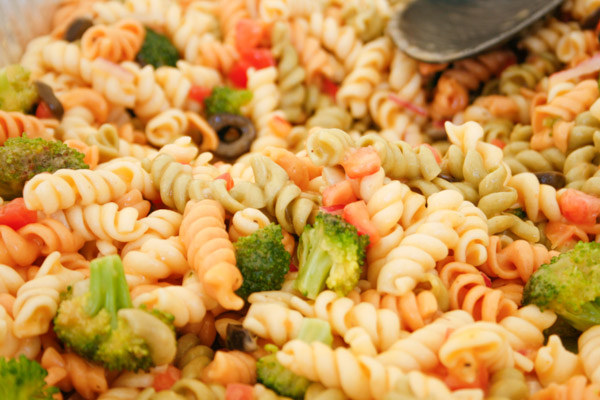 Pasta salad was spooned up …