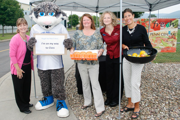 Helping the Wildcat welcome students to the first day of classes are (from left) Noelle R. Bloom, Shelley L. Moore, Erin S. Shultz and Kathy W. Zakarian, assistant director of counseling. They were among those distributing donuts, juice, fruit and goodwill at four locations Monday morning. 
