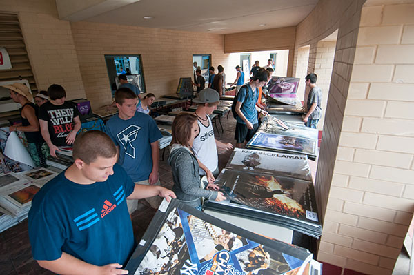Students pore over posters at a sale in the Campus Center, looking for just the right accent for an apartment wall.