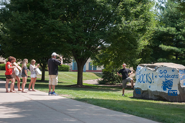 From one newcomer to another: A student stands by the campus' recent addition, a message 