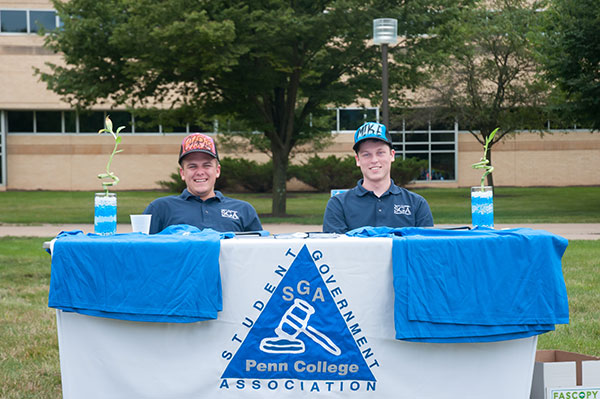 Christopher M. Scheller, 2013-14 executive vice president of the Student Government Association, and Michael L. Spear, this year’s president, strike a welcoming pose.