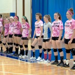 ... and on the court, where the Lady Wildcats await pre-match introductions.