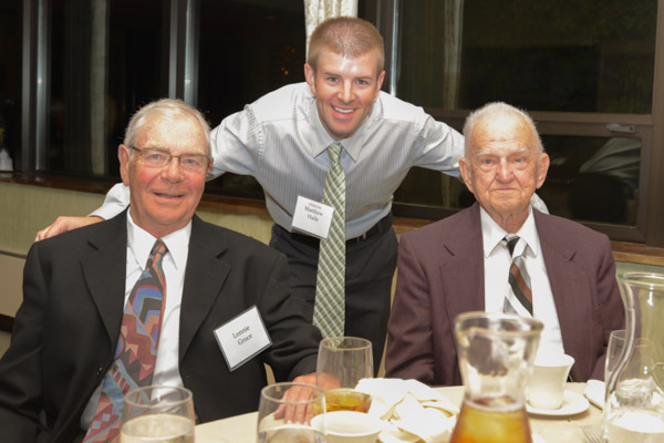 Matthew R. Haile with his mentors: His high school coach, Lonnie Grace (left) who introduced him to the banquet audience, and his 92-year-old grandfather, Robert, who introduced him to the sport of golf.