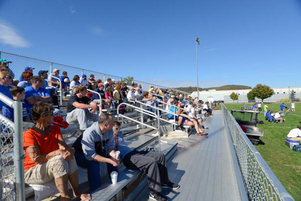 A vocal crowd fills the bleachers for a soccer doubleheader.