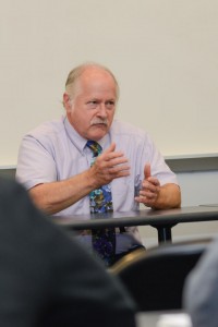 Roy P. Fontaine, professor of psychology, makes a point during the panel discussion …