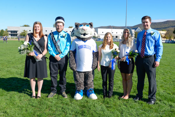 The 2013 Homecoming Court gathers at midfield. From left are Katie N. Reitbauer and Benjamin L. Thayer, king and queen; the Wildcat; Alexandra R. Donatelli, a building science and sustainable design: architectural technology concentration major from Perkiomenville; runner-up Alanna P. Ottenberg, of Williamsport, a construction management student; and Everett J. Zaluski, of Warrington, also majoring in construction management.