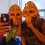 Other students enjoy donning screen-printed masks created by Vincent and taking photos for uploading to the artist's Twin Bee Press website (www.twinbeepress.com).