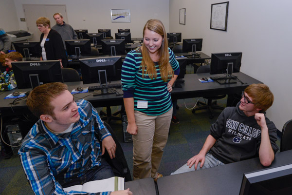Kendra N. Dutrow, a 2013 graduate in computer aided drafting technology and computer aided product design, chats with current students Daniel J. Webb (left) of Red Lion, and Sean R. Tredinnick,  from Paoli, both freshmen in engineering design technology.<br />
