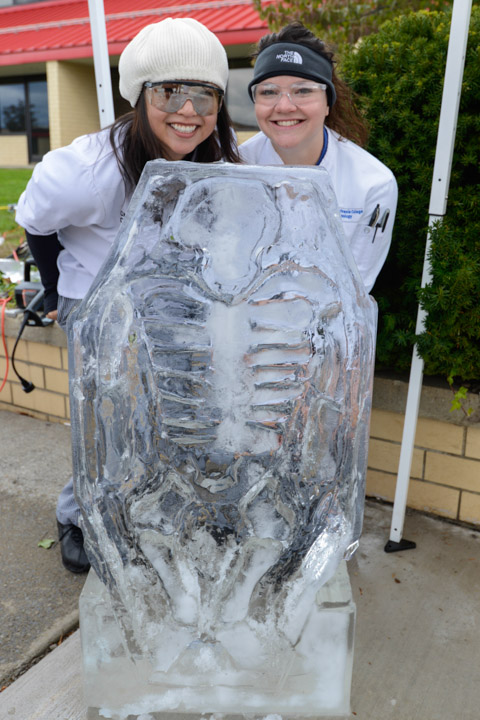 Posing with their skeleton ice sculpture are Ching Chan, of Milton (left), and Hanna A. Thompson-Hill, Millheim, both baking and pastry arts students. 