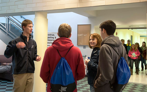 Presidential Student Ambassador John D. Wuest, on tour duty in the Bush Campus Center lobby.