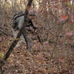 Bloomsburg University Cadet Wyatt C. Smeltzer tactically moves through the woods during a weekend training exercise.