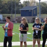 Jessica L. Bower joins her fellow Wilkes University honorees in a sideline ceremony ...