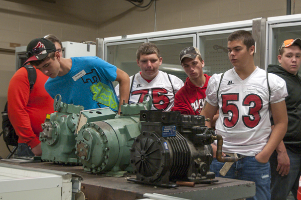 A group from Keystone Central Career and Technology Center look at the motors that power refrigeration systems. 