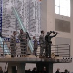 Cadets, with their cadre instructors, prepare to take the three-meter plunge.