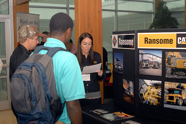 Ransome CAT recruiter Donna Evans looks over a student's resume.