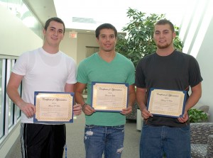 From left, Thomas P. Veres, of Scarsdale, N.Y.; Leonardo Tejeda, of New Rochelle, N.Y.; and Anthony V. Rode, of Lords Valley; hold their certificates outside Penn College's administrative offices.