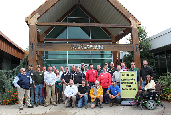 Reunion attendees add their impressive presence to the rustic entrance of the Schneebeli Earth Science Center.