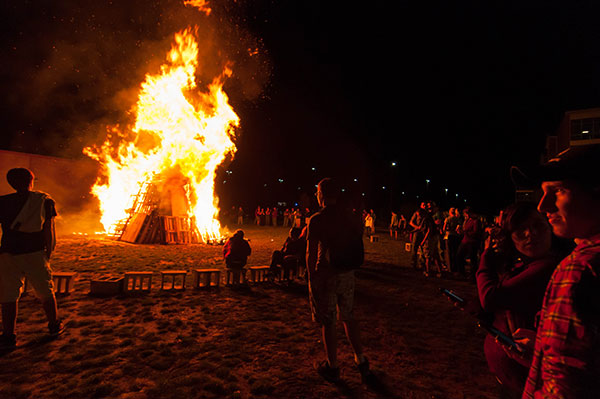 Friday's Homecoming bonfire warms the crowd.