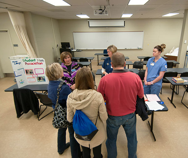 Nursing students and faculty greet visitors to the relocated labs in the Breuder Advanced Technology and Health Sciences Center.