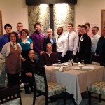 Erin J. McMurray, lab supervisor for physical fitness specialist (seated at center) is surrounded by her mentees and restaurant staff.