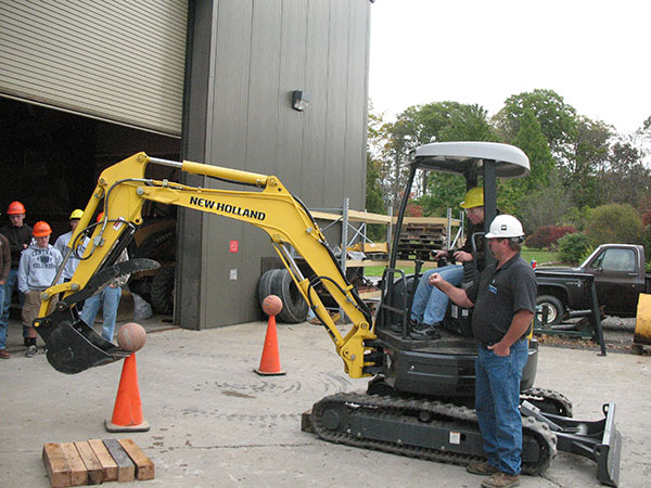 Career Day visitors to the Schneebeli Earth Science Center learn excavator operation and safety ... while engaging in a fun 