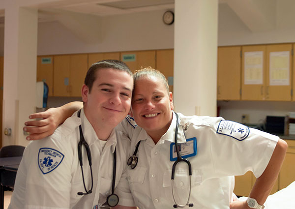 Emergency medical services majors Samuel D. Piatt, of Bedford, and Coral R. Bloom, of Montoursville, put their friendliest faces forward in the ACC basement.