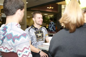 Tyler C. Knabb, a Penn State student riding his bicycle 900-plus miles for a related charity, takes a lunch break with Penn College Benefiting THON members on Oct. 24. Students met with Knabb in the Keystone Dining Room, offering him sustenance and encouragement for the remainder of his trip.
