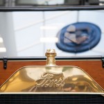 The Penn College seal is reflected in the Model T windshield.