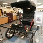 A vintage Oldsmobile, another visible link between the college's past and its popular automotive restoration technology major, greets visitors library visitors.