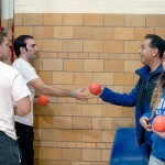 Intramural student assistant Timothy J. Stasulli (left) and Presidential Student Ambassador Rafael Correa – both information technology: information assurance and security concentration majors – distribute throw balls ...