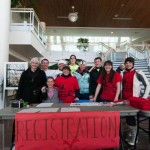 Smiles greet registrants inside the Student and Administrative Services Center.
